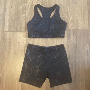 Matching zyia reflective set sports bra and biker shorts
